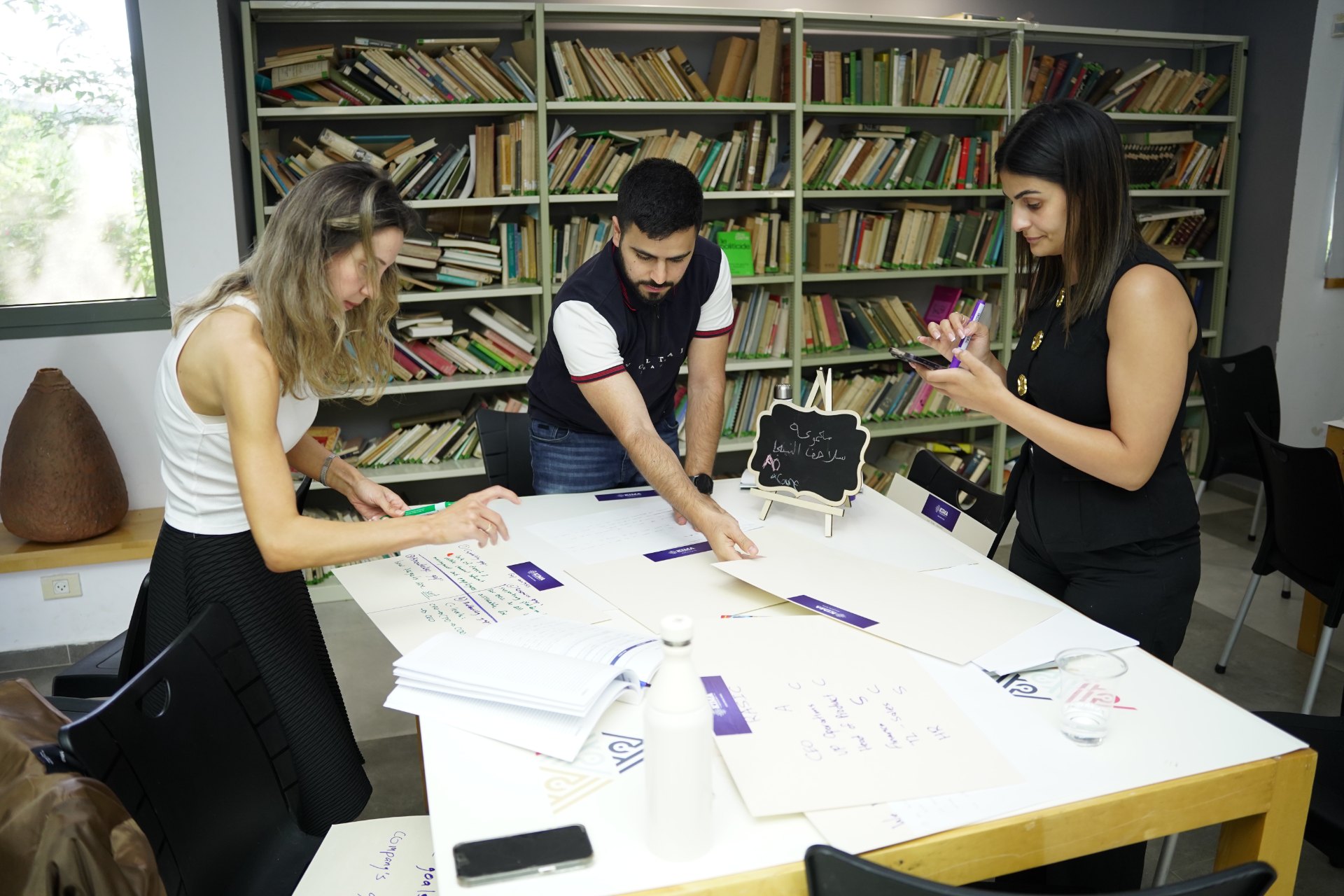 Founders working through a value canvas together at the Rahat startup school
